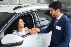 Woman buying new car.