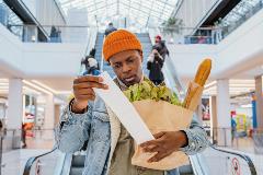 Gentlemen with bag of groceries