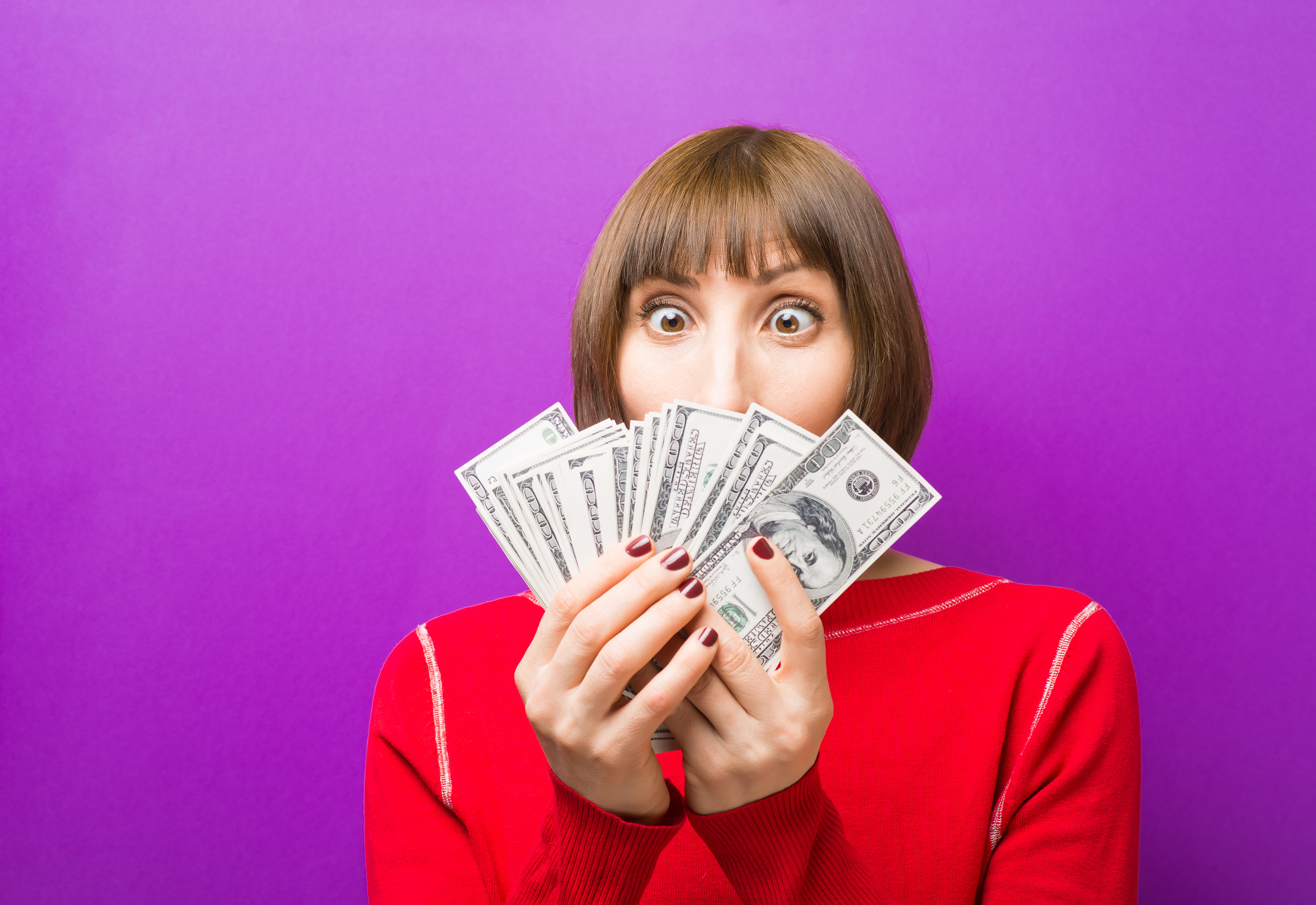 Lady holding cash in her hands