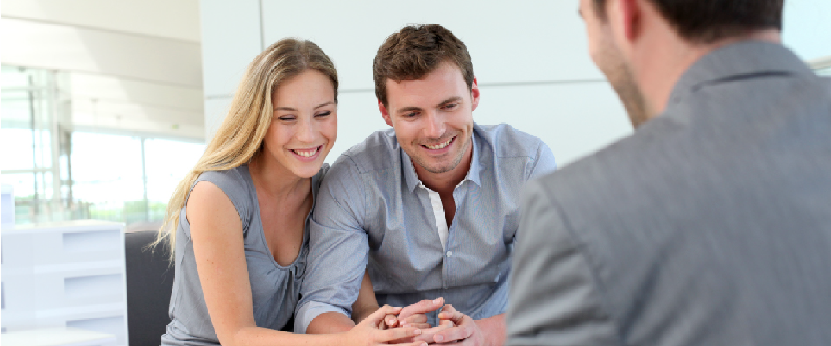 Young couple meeting with a businessperson