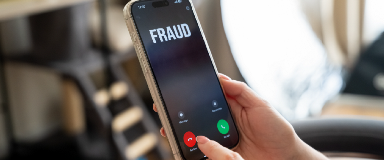 Woman declining a fraudulent call on her cell phone.