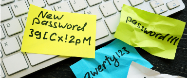 Sticky notes with passwords on a keyboard