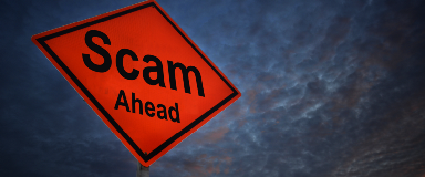 Sign that reads "Scam Ahead" with storm clouds in the background