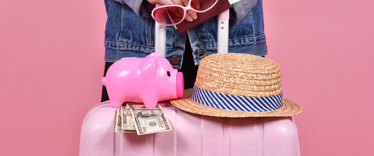 Woman holding a suitcase with a hat and some cash money.
