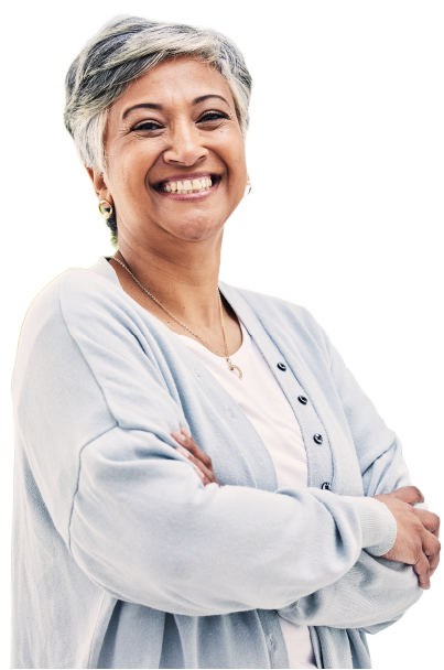 Happy older woman smiling and standing with her arms crossed