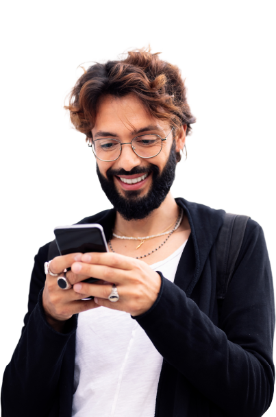 Smiling guy looking at phone