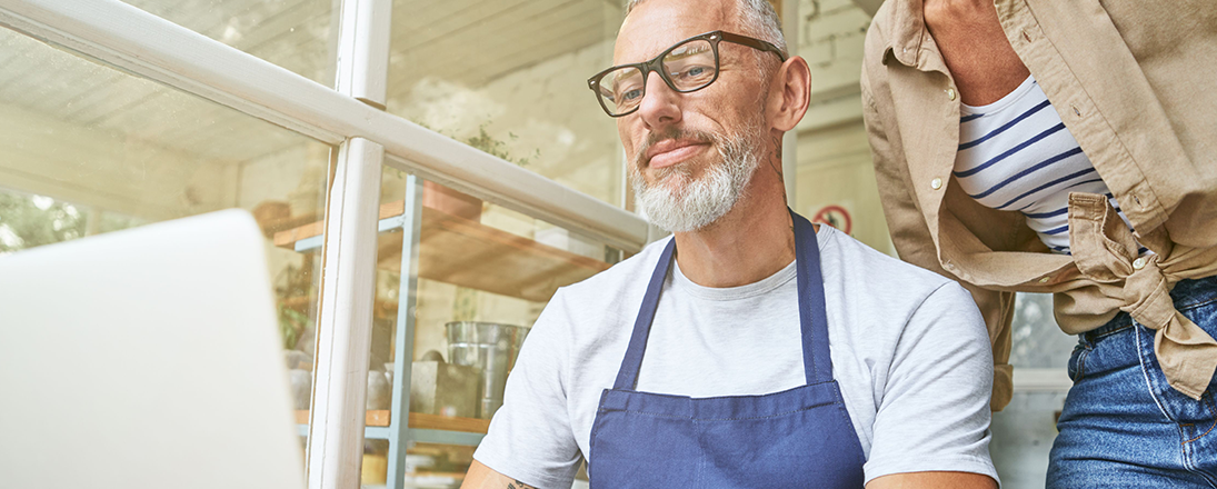 Small business partners looking at computer