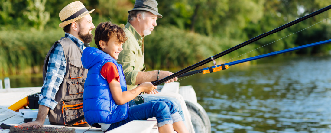 Grandfather, father, and child fishing