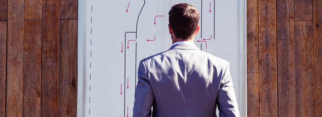 Man looking at a plan or map