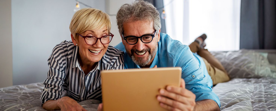 Smiling couple on computer