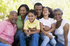 Family smiling looking at camera