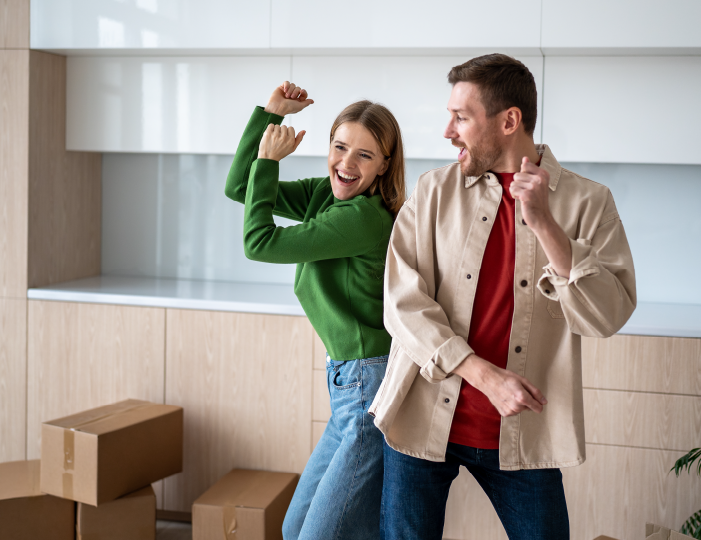 Couple dancing in new house